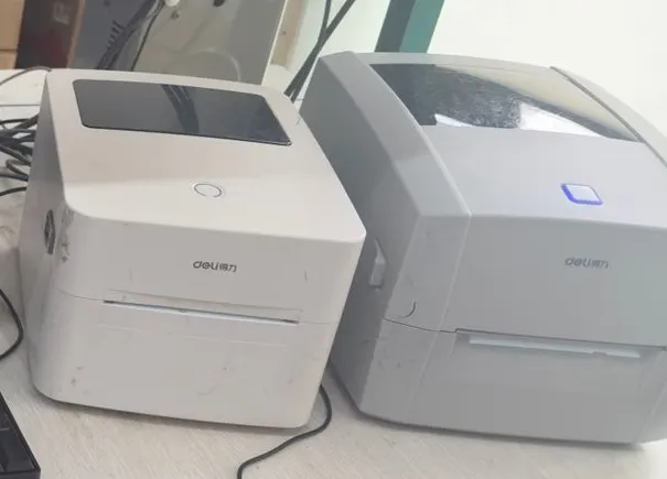 Two label printers at an ecommerce order-preparation workstation